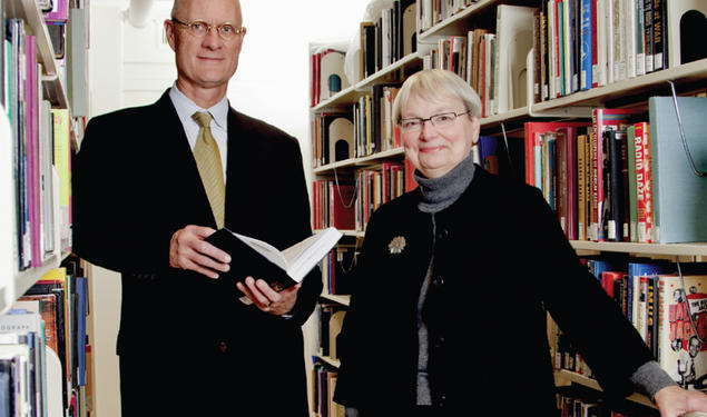  Librarian Karin Trainer (right) and University Architect Ron McCoy *80 review new shelving planned for Firestone Library as part of its forthcoming renovation.  