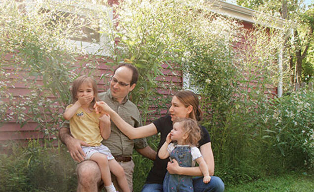 John Jameson ’04 enjoys his flower garden with his wife, Lucy ’06, and their daughters.