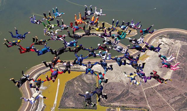 George White ’57 is at 12 o’clock of the inner ring of eight, in black, in this 2012 world-record jump.