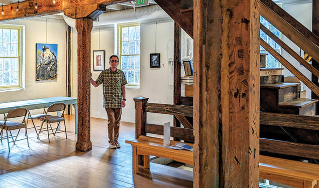 Angelo Otterbein ’95 inside Manor Mill, left, and what it looked like before the renovations were underway, above.