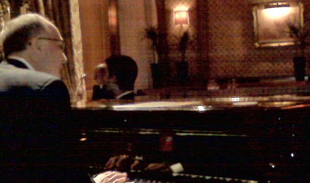 A cellphone photo captures Thomas Schiavoni ’72’s moment at the Steinway of the Bar Vendome in the Hotel Ritz in Paris. 