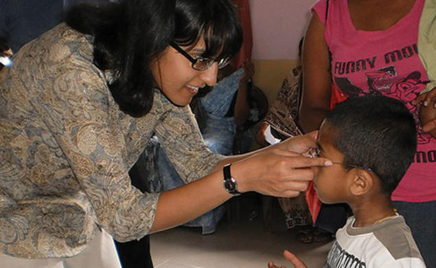 A nonprofit founded by Ashanthi Pereira Mathai ’95, left, has provided prescription eyeglasses to 35,000 children and adults.