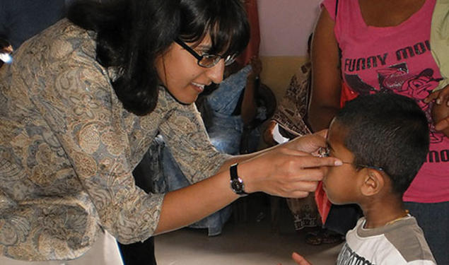 A nonprofit founded by Ashanthi Pereira Mathai ’95, left, has provided prescription eyeglasses to 35,000 children and adults.