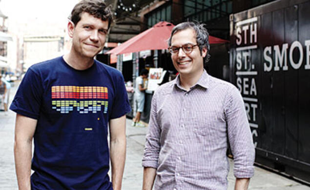   Jonathan Butler ’92, left, and his business partner Eric Demby at the Brooklyn Flea’s SmorgasBar at South Street Seaport in Manhattan.
