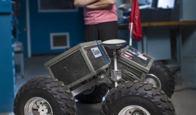 Laura Ray ’84 *91 with Yeti, the robot she and her students built.