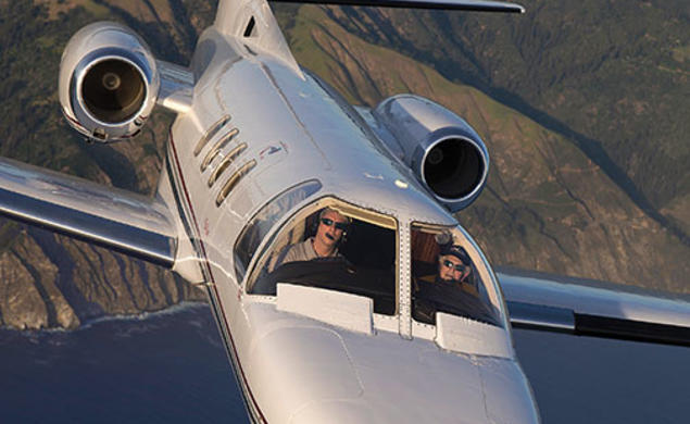 Howard Tobin ’60 at the controls of his Citation Jet, which he uses to transport wounded veterans.