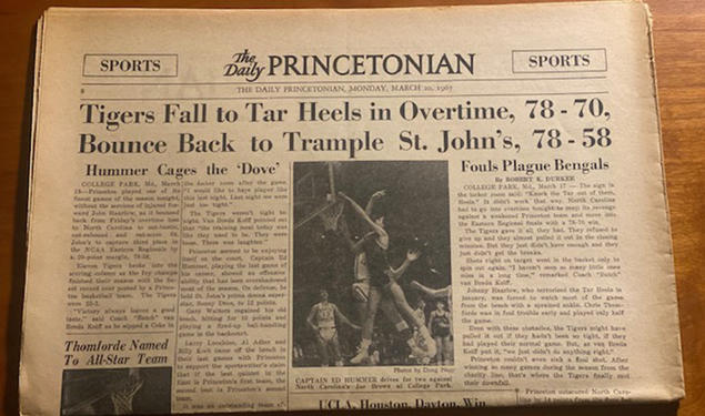 A yellowed copy of The Daily Princetonian on March 20, 1967, with a banner headline reading, "Tigers Fall to Tar Heels in Overtime, 78-70, Bounce Back to Trample St. John’s, 78-58."