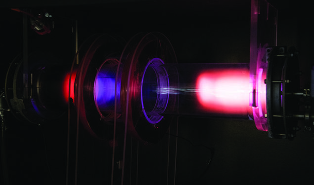 Pink glowing plasma inside PPPL’s Science Education Lab