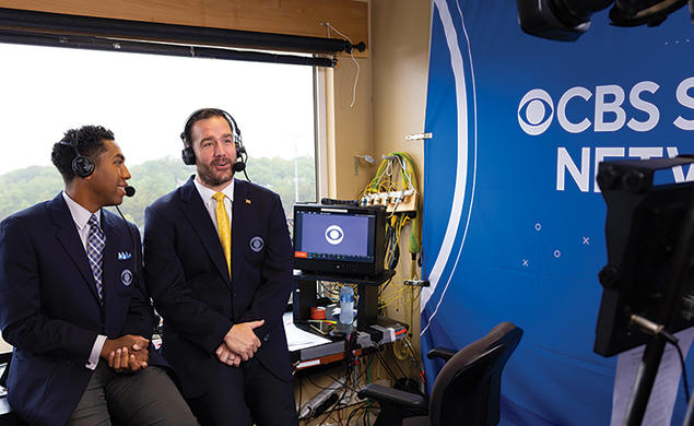 Ross Tucker ’01, right, makes one of his many broadcasting stops this fall, calling the Army-Boston College game in West Point, New York.