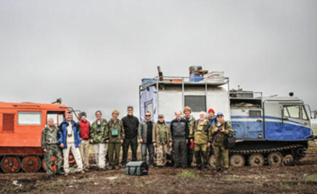 Members of the July 2011 expedition to Russia stand in front of trucks fitted with tank treads to crawl across the permafrost; from left, Bogdan Makovskii, Glenn MacPherson *81, Will Steinhardt, Chris Andronicos *99, Marina Yudovskaya, Luca Bindi, Victor 