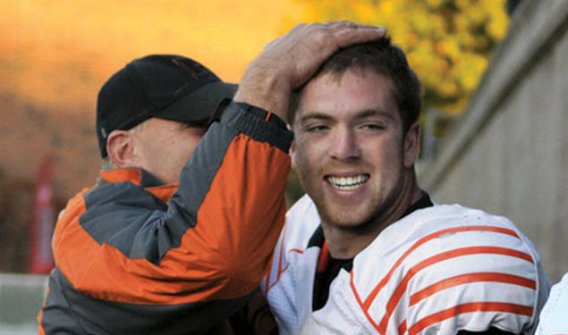 Quarterback Quinn Epperly ’15 is congratulated after his sixth touchdown pass of the day beat Harvard, 51–48.