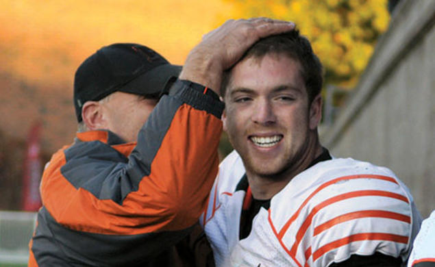 Quarterback Quinn Epperly ’15 is congratulated after his sixth touchdown pass of the day beat Harvard, 51–48.