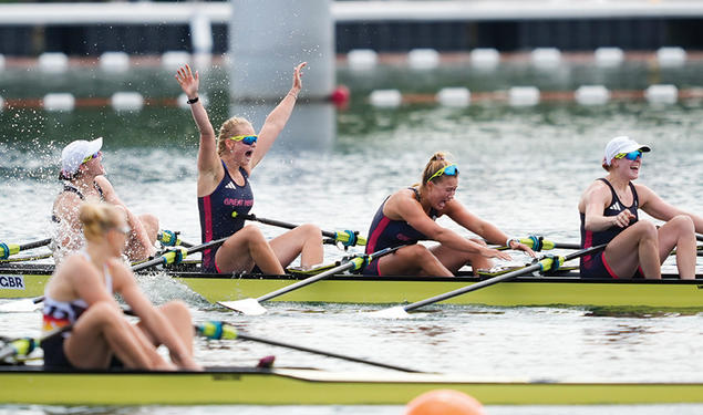 Sitting in a crew boat, Hannah Scott ’21, arms raised, celebrates Great Britain’s narrow victory in the quadruple sculls. 