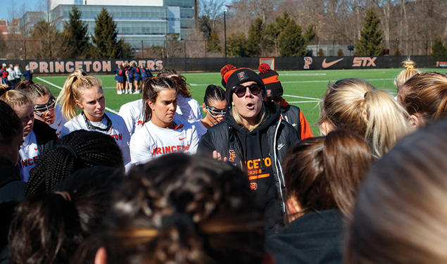 Jenn Cook speaking to her team