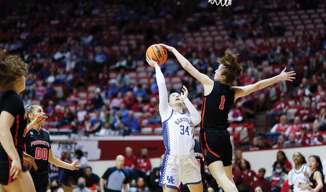 Senior guard Abby Meyers blocks a shot by a Kentucky guard during Princeton’s first game of March Madness in Bloomington, Indiana. 