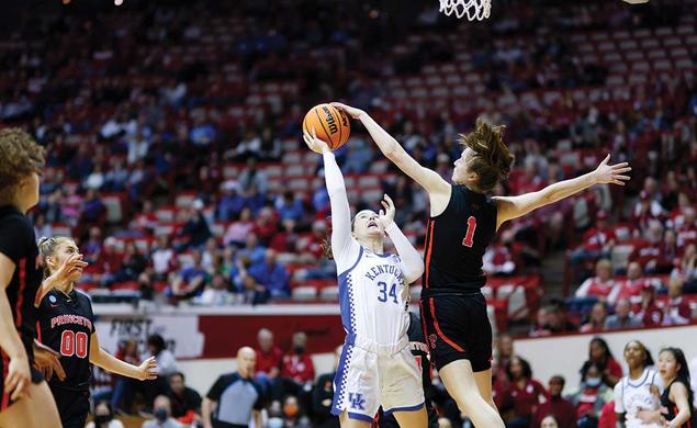 Senior guard Abby Meyers blocks a shot by a Kentucky guard during Princeton’s first game of March Madness in Bloomington, Indiana. 