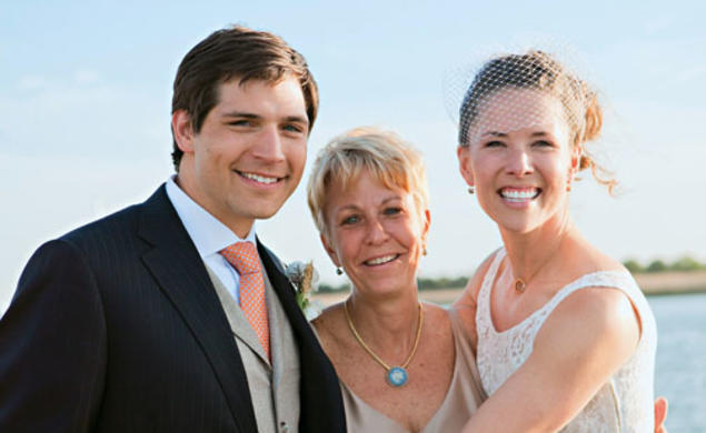 Swimming coach Susan Teeter, center, officiated at the May wedding of Alyson Goodner ’00 and Paul Daniels.