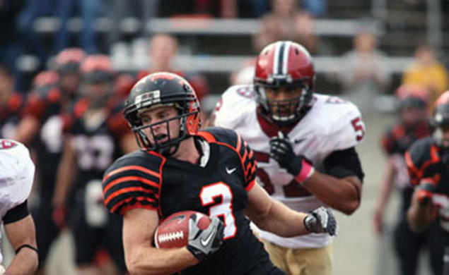 Roman Wilson ’14, shown in the fourth quarter, caught a 36-yard touchdown pass with 13 seconds left in the game to give the Tigers a 39–34 victory over Harvard.