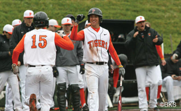 Much of the Tigers’ success this season comes from its versatile roster. Players such as Matt Bowman ’13 (at center facing camera, greeting Jonathan York ’14) play more than one position.