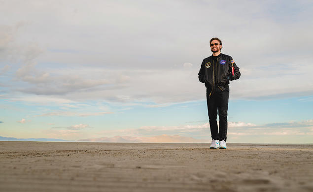 Tralie stands alone with his wonder in the Utah desert.