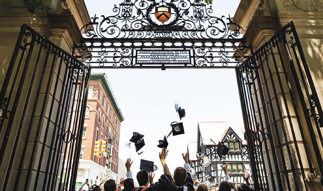 Princeton’s newest alumni make their exit through FitzRandolph Gate following Commencement.