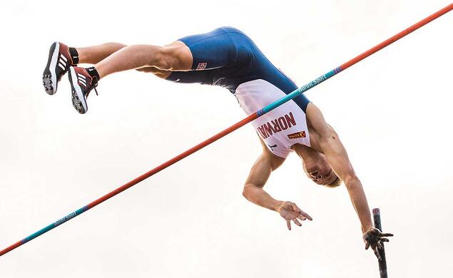 This is a photo of Sondre Guttormsen ’23 competing in the pole vault for Norway.