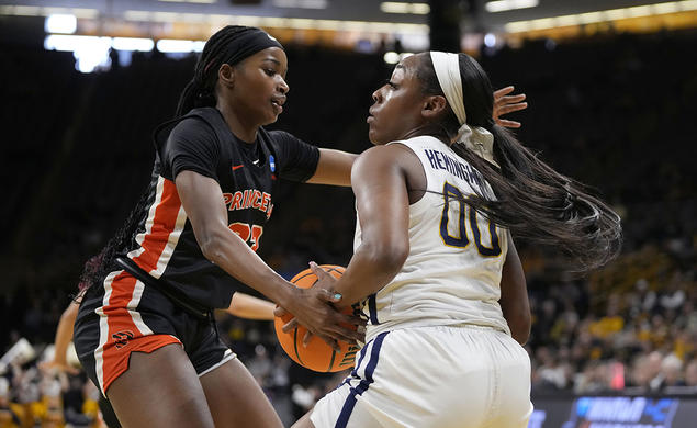 Madison St. Rose ’24, left, defends West Virginia guard Jayla Hemingway, with ball