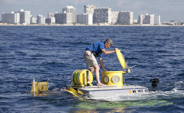 In this photo from June 2013, Stockton Rush ’84 opens the hatch on submersible “Antipodes,” which OceanGate used to offer scientists and wildlife officials a close-up look at the invasive lionfish deep in the waters off South Florida.