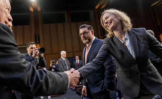 Kathleen Bradish ’94 shakes hands with Chairman Sen. Dick Durbin, D-Ill. at a Senate Judiciary Committee hearing to examine promoting competition and protecting consumers in live entertainment on Capitol Hill in Washington, in January 2023.