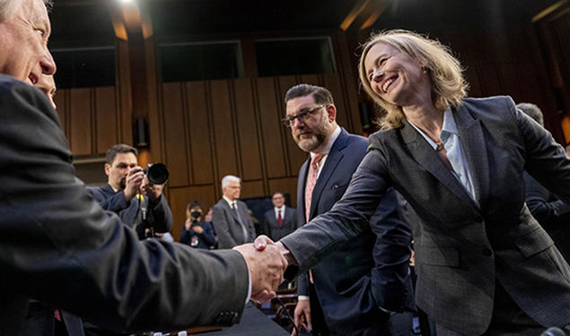 Kathleen Bradish ’94 shakes hands with Chairman Sen. Dick Durbin, D-Ill. at a Senate Judiciary Committee hearing to examine promoting competition and protecting consumers in live entertainment on Capitol Hill in Washington, in January 2023.