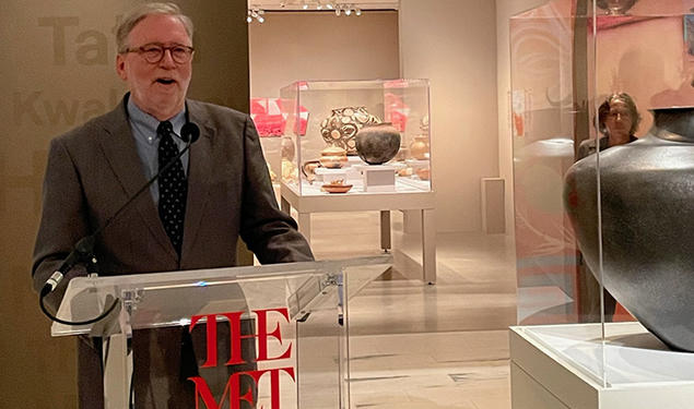Michael Brown ’72 speaks at The Met in front of the Pueblo pottery exhibit.