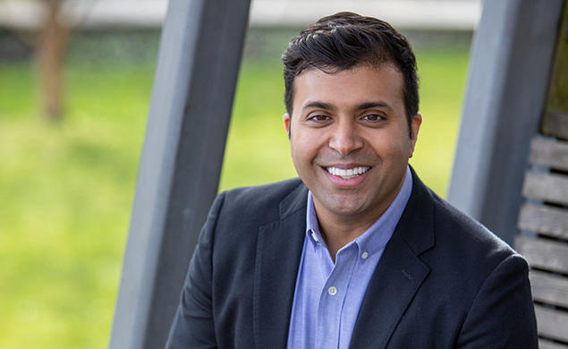 This is a headshot photo of Taleeb Noormohmaed ’98 outdoors.