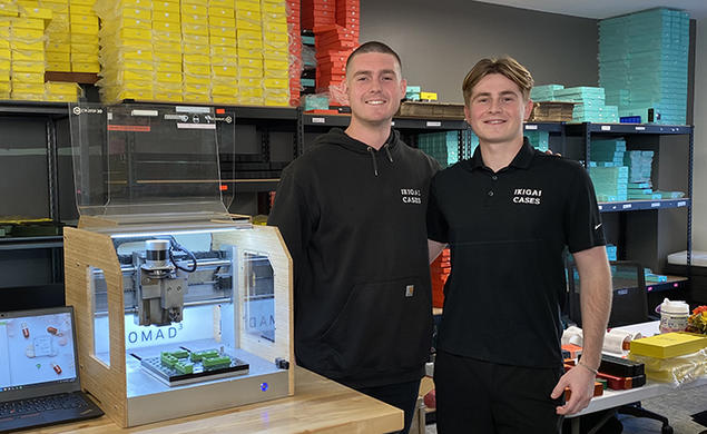 Tavish Rice ’20, left, and his brother Breton at work in a lab.