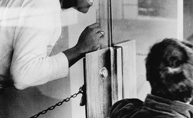 Brent Henry ’69, a leader of the Association of Black Collegians and today a Princeton trustee, behind the chained door of the New South administration building.