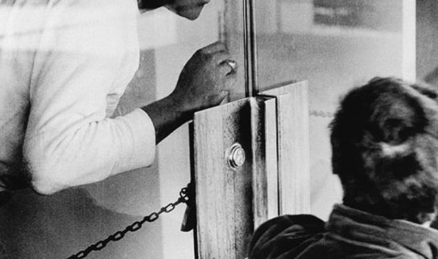 Brent Henry ’69, a leader of the Association of Black Collegians and today a Princeton trustee, behind the chained door of the New South administration building.