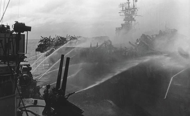 Alan Reed ’40 died after boarding the USS Princeton, in flames, Oct. 24, 1944. He was assigned to the USS Birmingham, shown here fighting the fire.