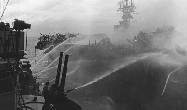 Alan Reed ’40 died after boarding the USS Princeton, in flames, Oct. 24, 1944. He was assigned to the USS Birmingham, shown here fighting the fire.