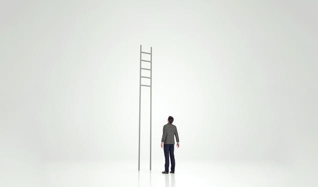 Man looking at ladder with rungs out of reach