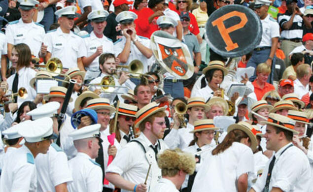 After booing the Princeton band’s halftime show, Citadel cadets surround the band in the stands.