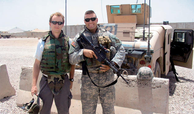 Author Whitney Terrell, left, with Nate Rawlings '04 at Camp Liberty in Iraq in July 2006.