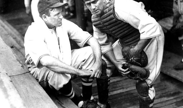 Moe Berg '23 and player-manager Joe Cronin in the Boston Red Sox dugout, circa 1937. Berg played in the major leagues for 15 seasons, mostly as a backup catcher, compiling a .243 lifetime batting average.