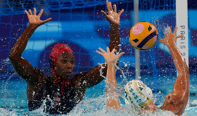 Ashleigh Johnson ’17, left, defends a shot by Australia’s Danijela Jackovich in the Olympic semifinals.