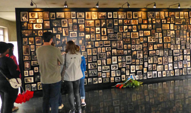 Princeton students learning about the history of Polish Jews view photos at Birkenau, part of the Auschwitz concentration camp in Poland built by the Nazis.