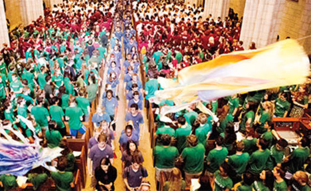 Kites ﬂy overhead as freshmen leave the University Chapel to begin the Pre-rade