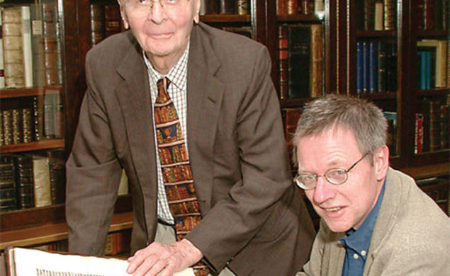 In this 2002 photo, William H. Scheide ’36 (standing) and Scheide Librarian Paul Needham look over some of the first printed editions of the Bible, which are part of the magnificent collection of rare books and manuscripts that now have a permanent home
