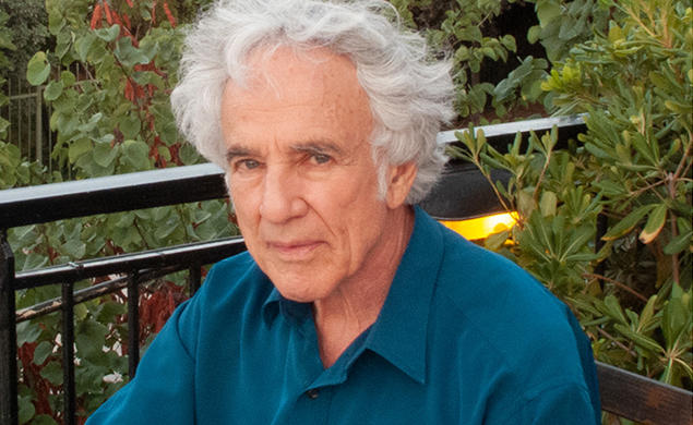 This is a headshot photo of Stanley Corngold outdoors.