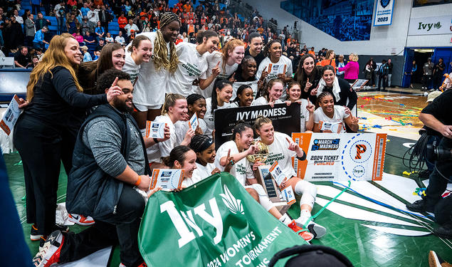 Princeton women's basketball team poses for celebratory photo on the court