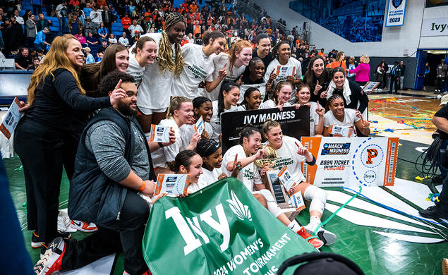 Princeton women's basketball team poses for celebratory photo on the court