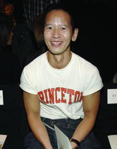 Long Nguyen ’84 wearing a white T-shirt that says PRINCETON in orange letters.