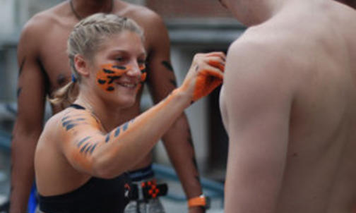 Primed and painted, students keep RAWR-ing at football games